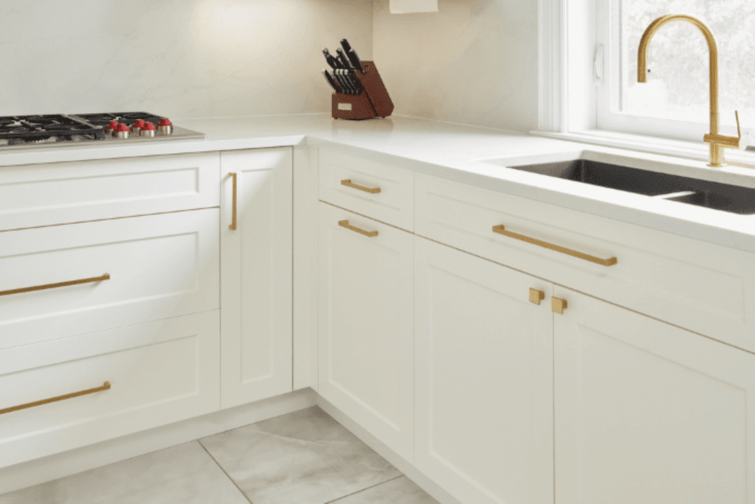 White kitchen cabinets with gold hardware