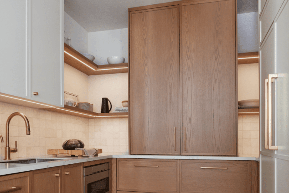 White oak kitchen cabinets with open shelves in the corner