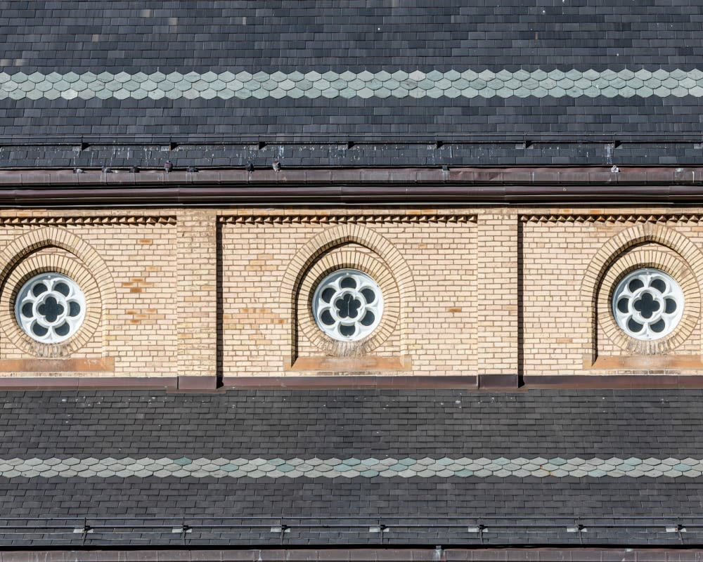 Three detailed brick windows.