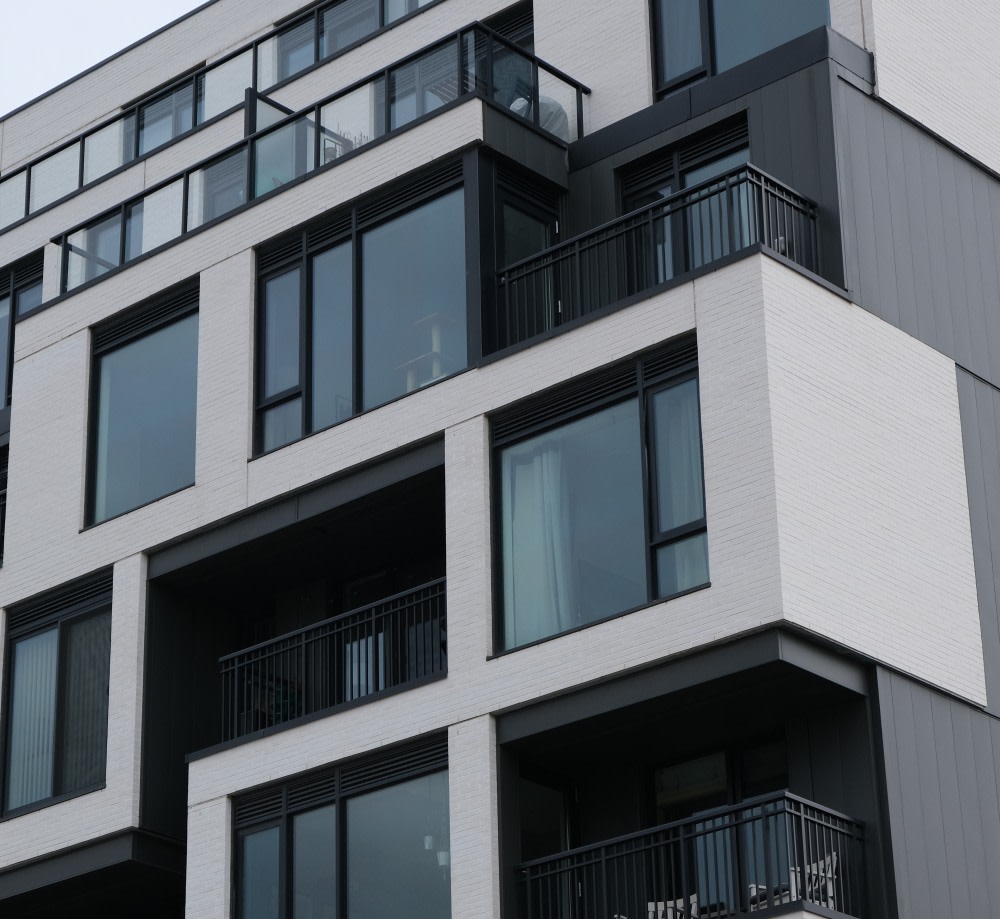 Grey and black condo building.