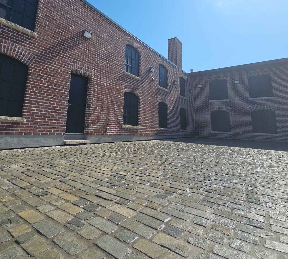 Courtyard of red brick builidng.