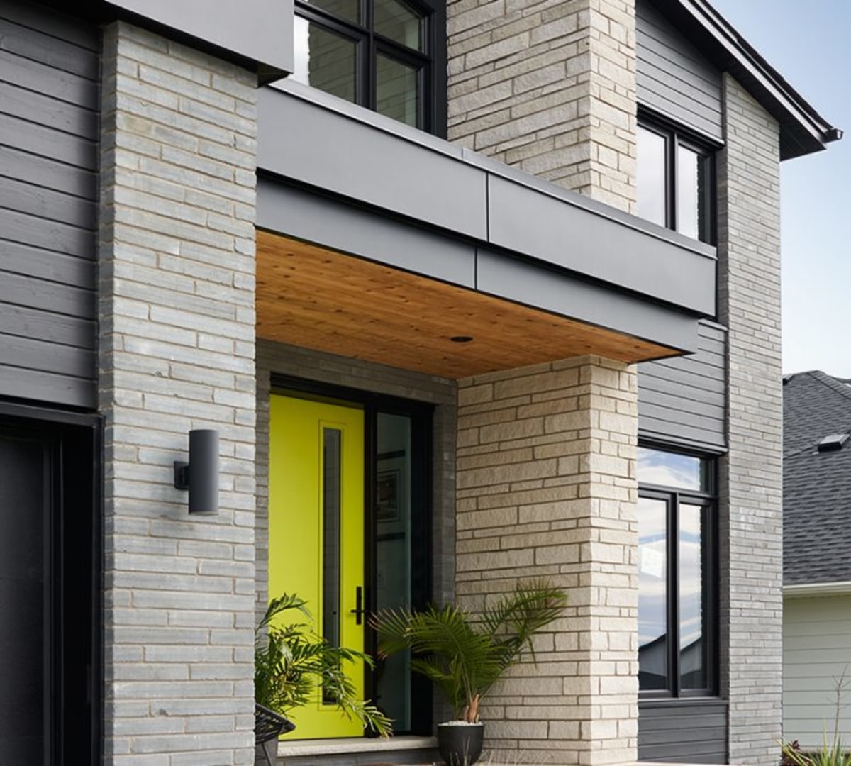 Brick house with lime green door.