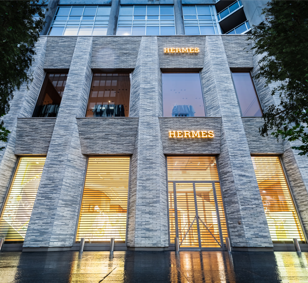 Hermes store front with interior lit up. 