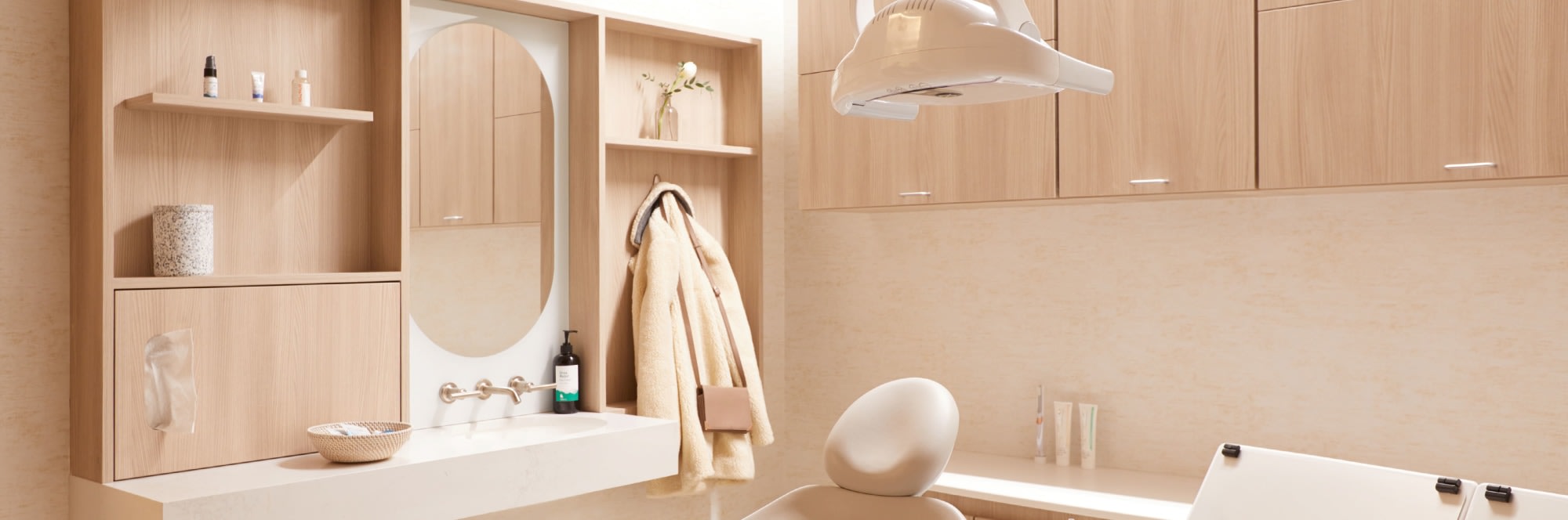 Counter, mirror, shelves and coat hooks behind treatment chair.