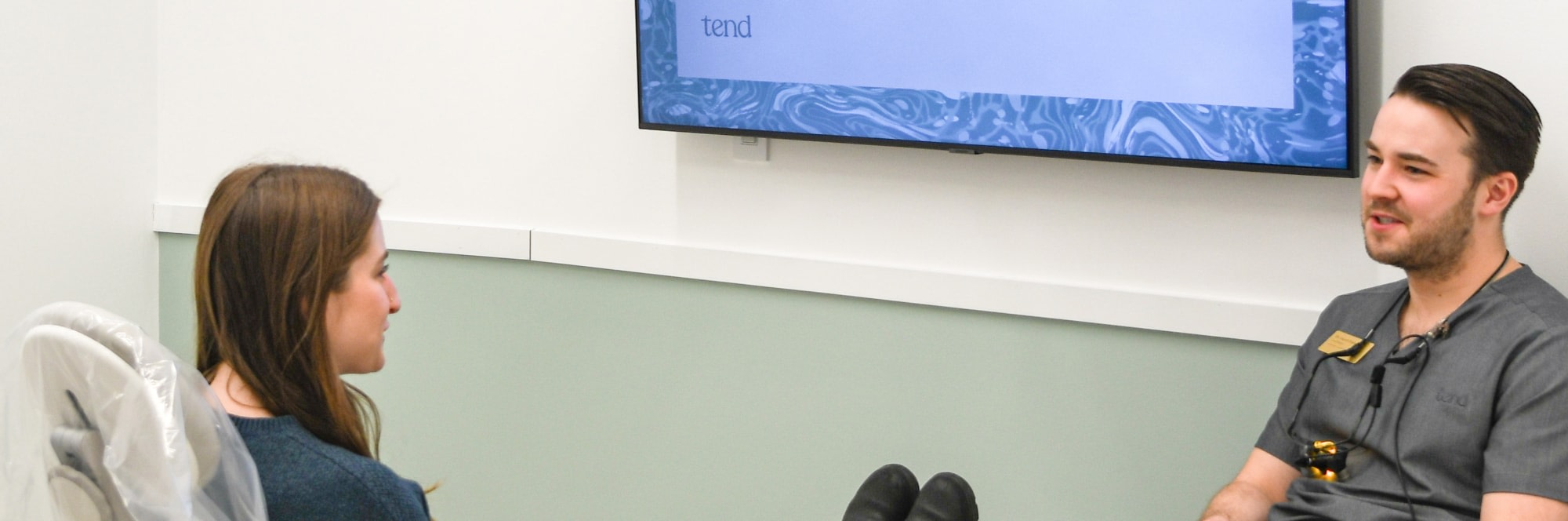 A team member chats with a patient.