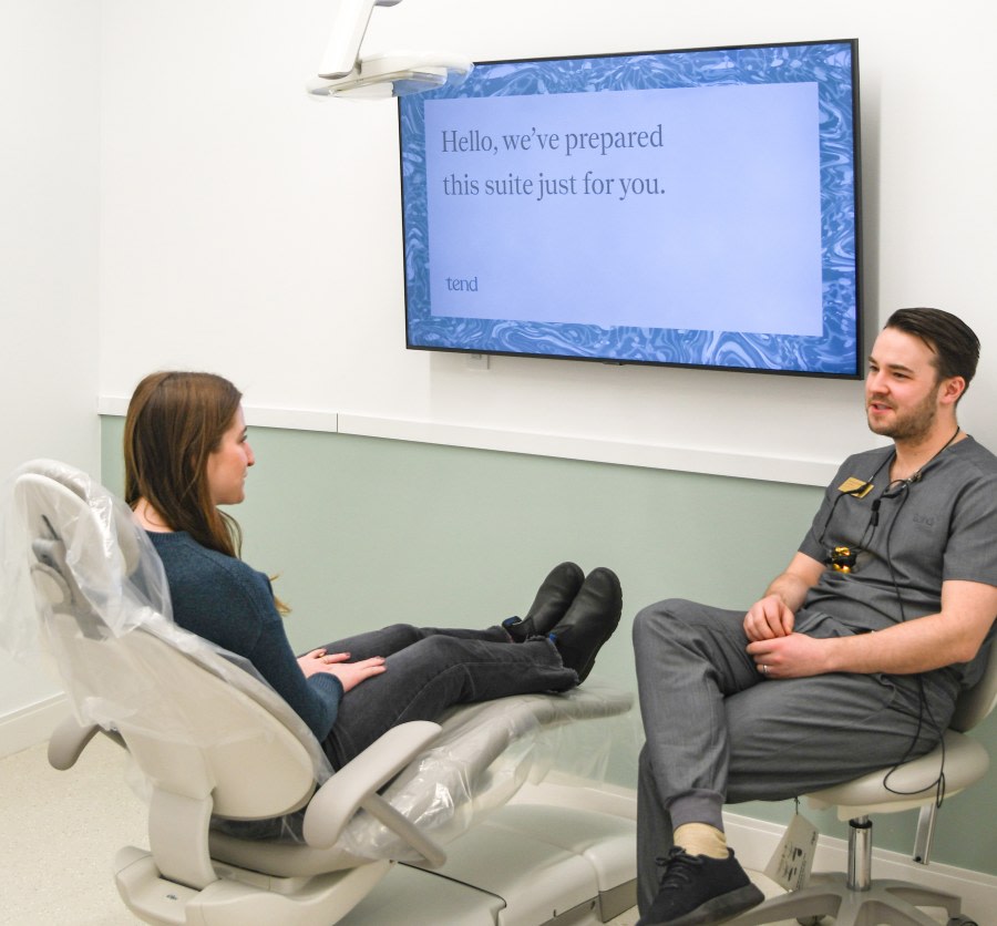 A team member chats with a patient.