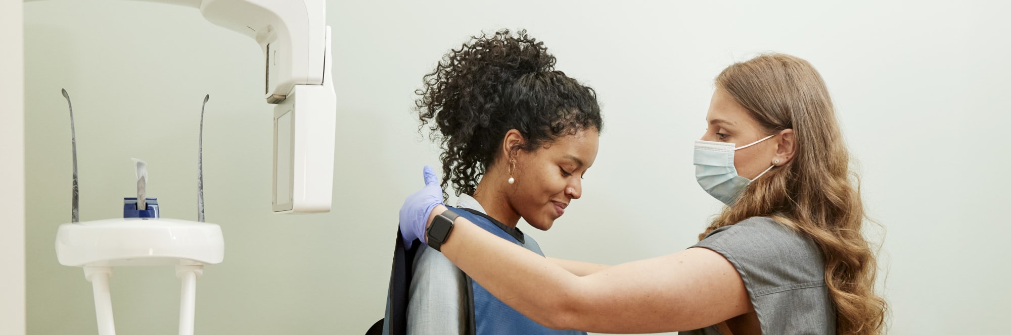 A patient is prepped for a dental X-ray.