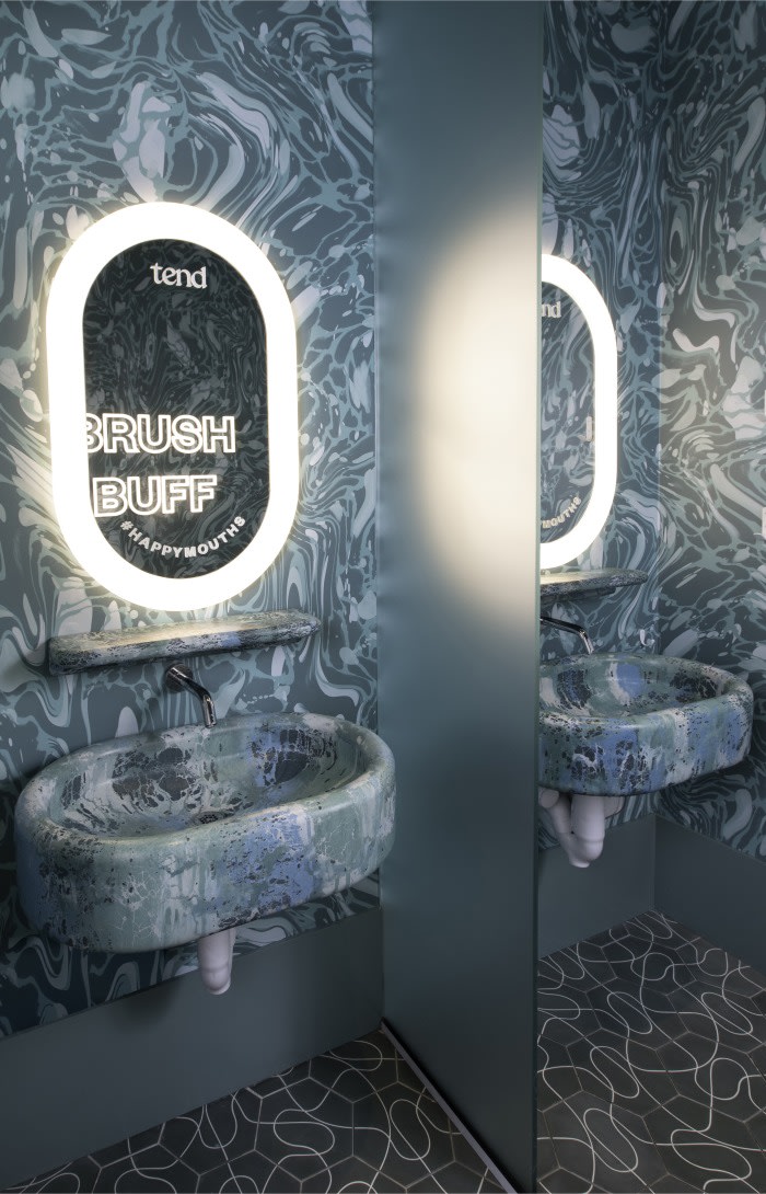 Sink and mirror in teeth brushing area.