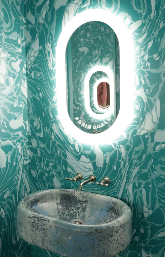 Sink and mirror in teeth brushing area.