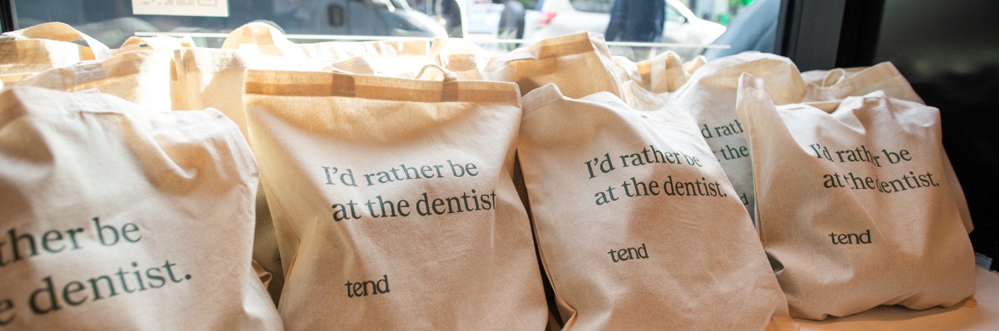 Reusable bags that say 'I'd rather be at the dentist'.