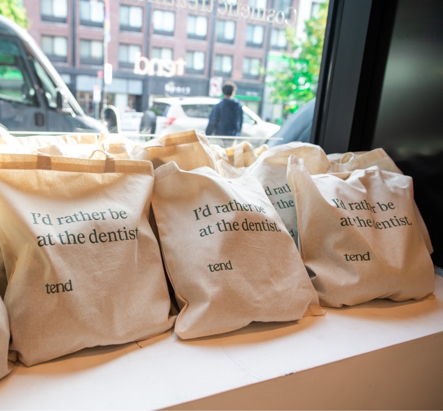 Reusable bags that say 'I'd rather be at the dentist'.