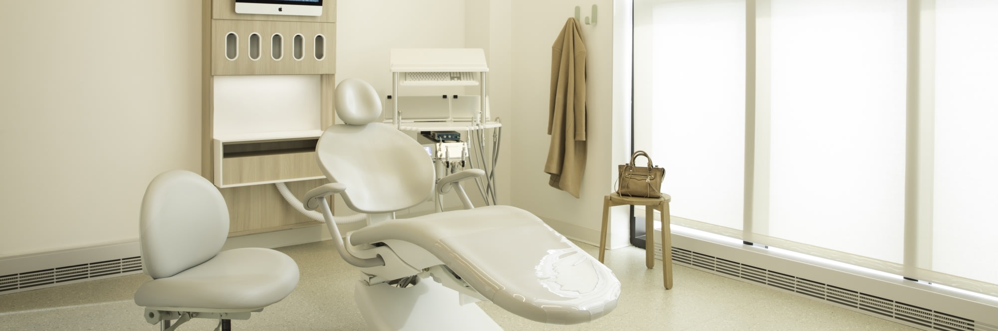 Counter, shelves and dental tools in treatment room.