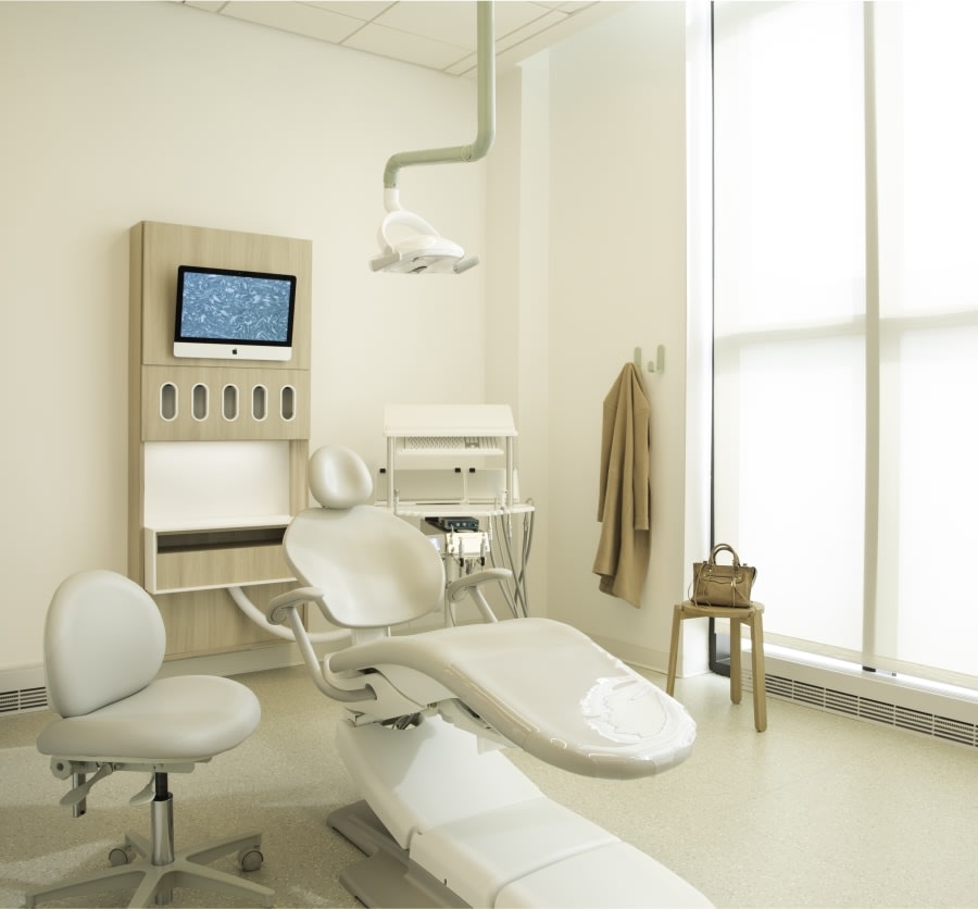 Sink, shelves, and dental tools in treatment room.