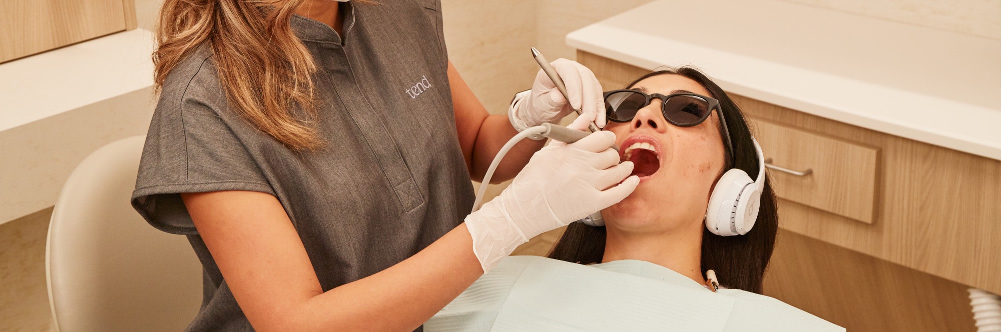 A patient receives a dental exam.