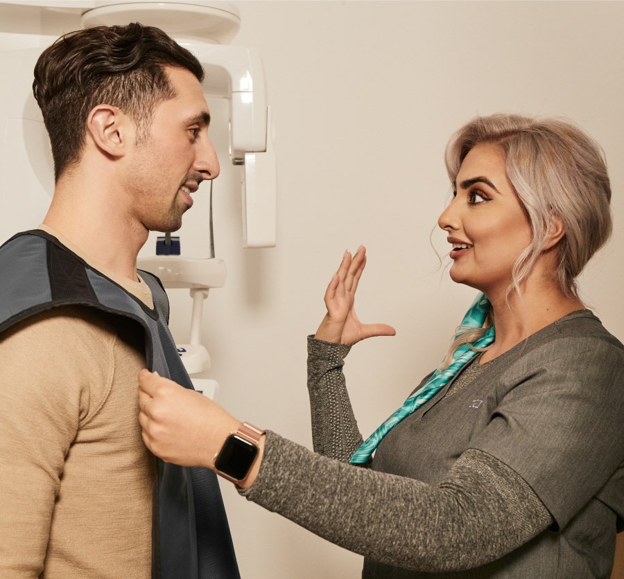 A patient is prepared for a dental X-ray.
