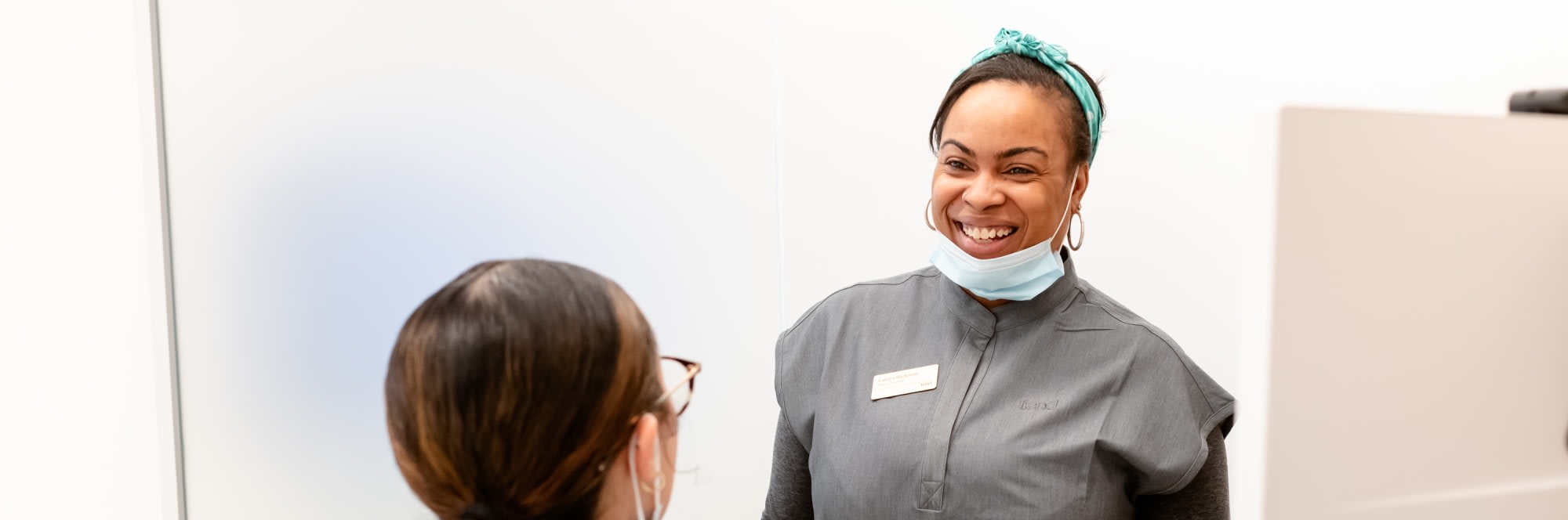 A team member smiles.