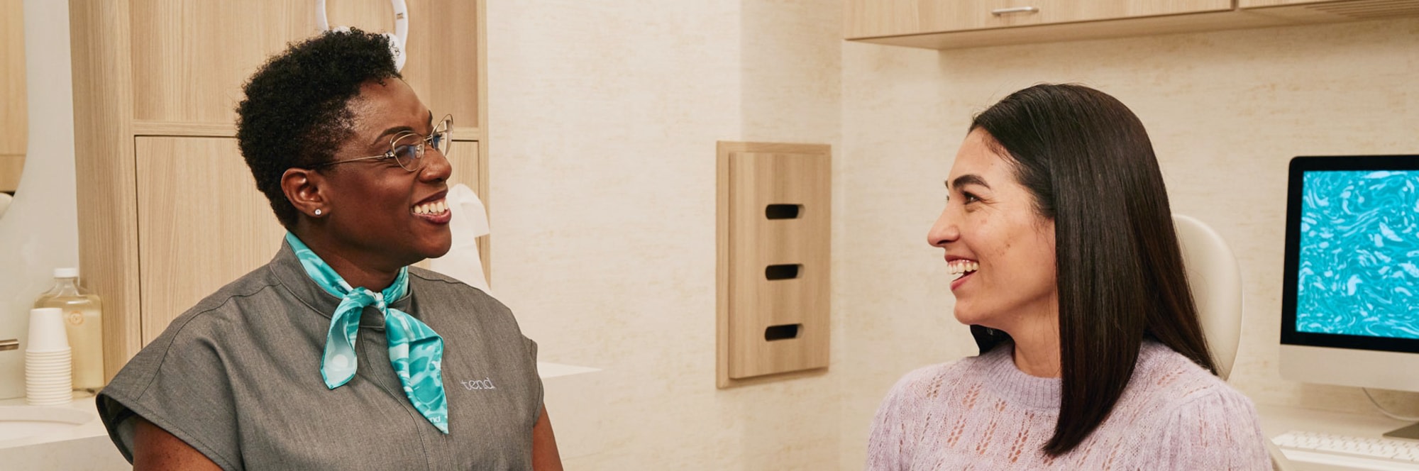 A team member speaks with a patient.