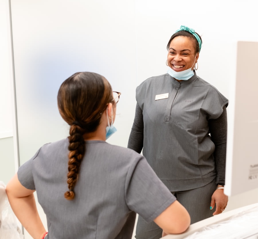 A team member smiles.