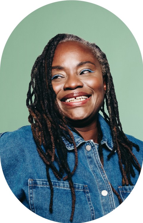 An older woman in a denim jacket is looking to the left.