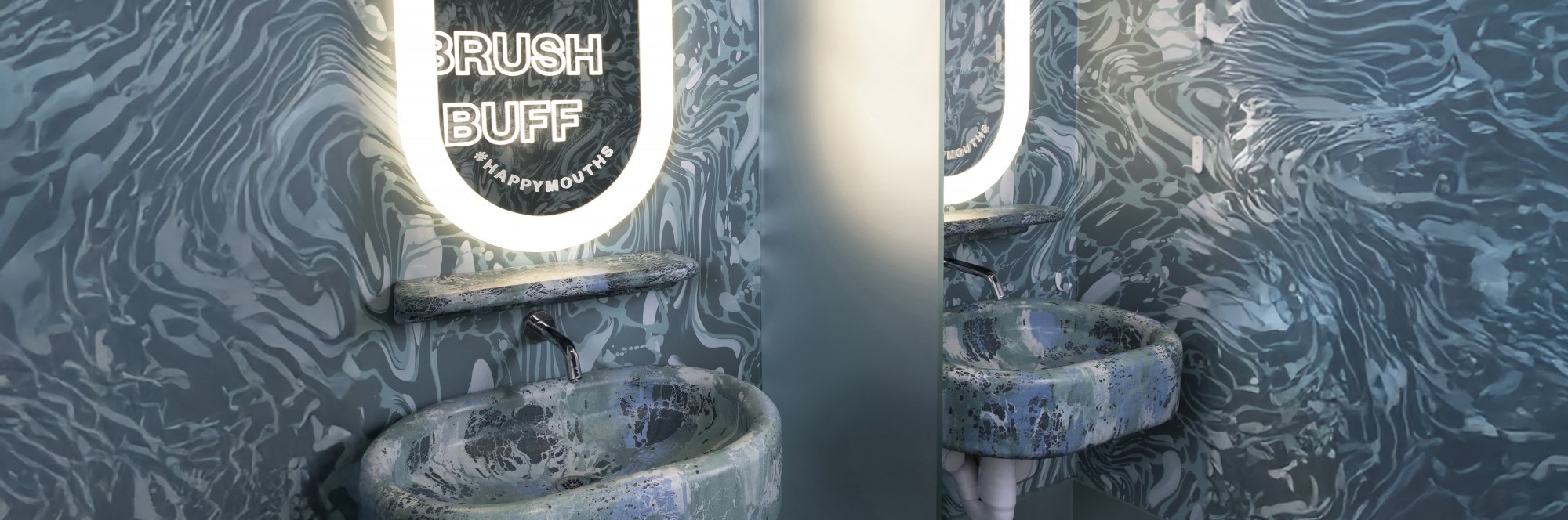 Sink and mirror in teeth brushing area.