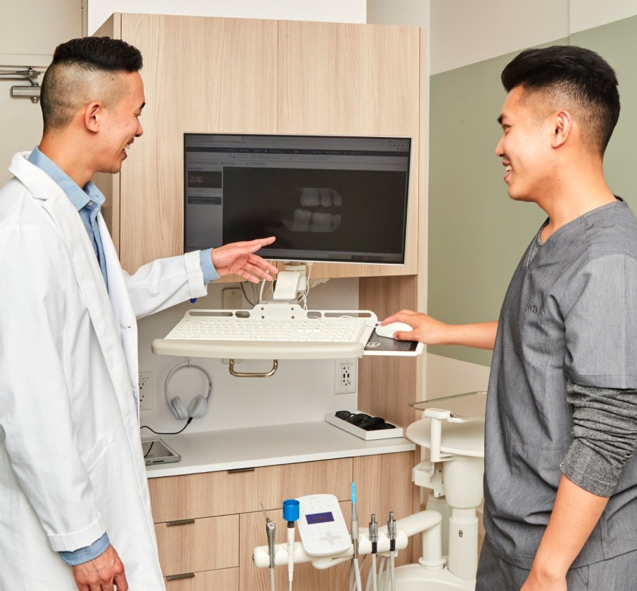 Two team members look at an X-ray.