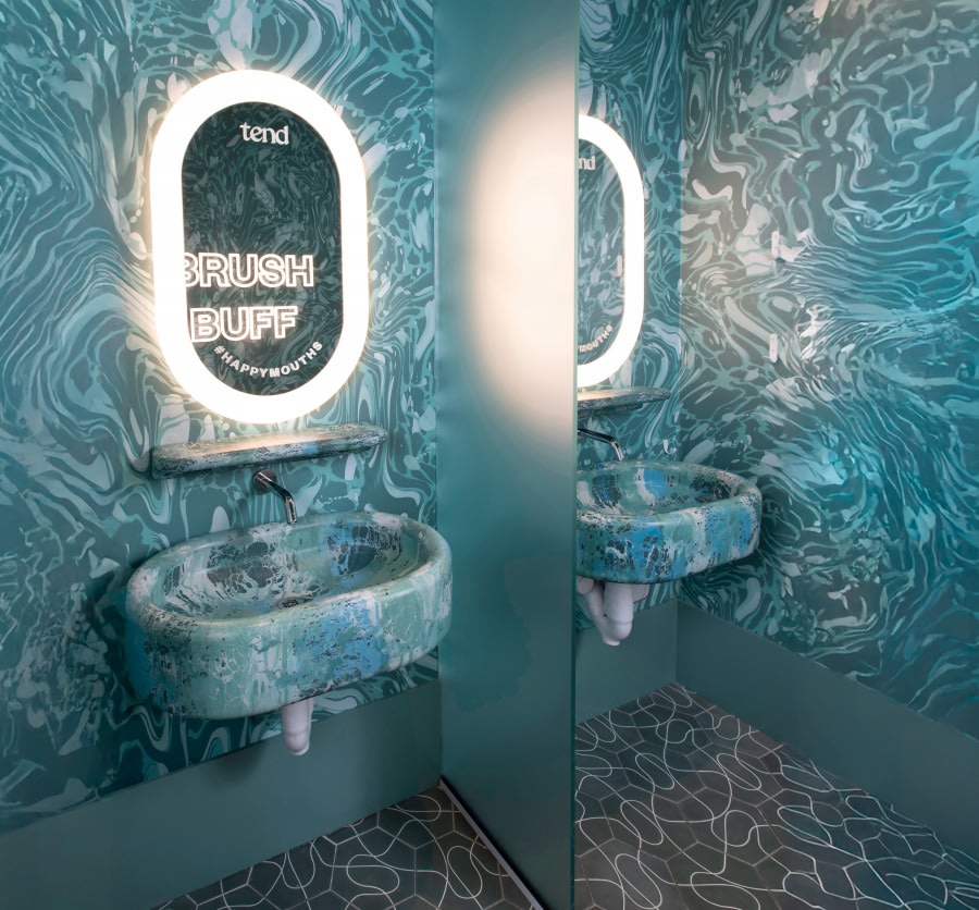 Sink and mirror in teeth brushing area.