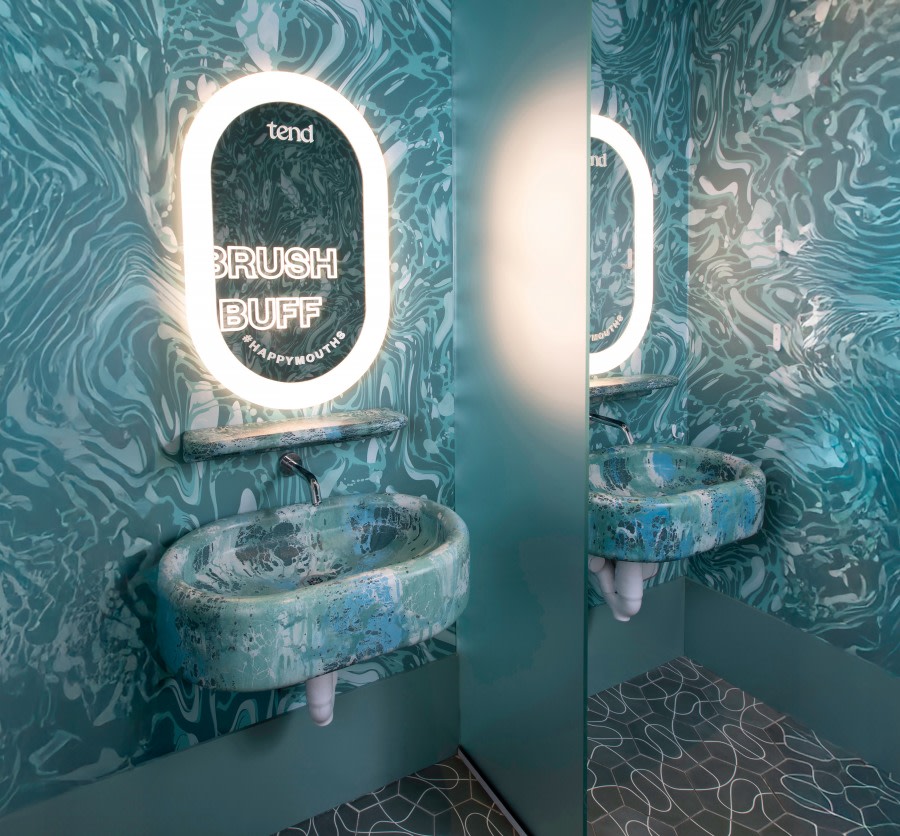 Sink and mirror in studio teeth brushing area.