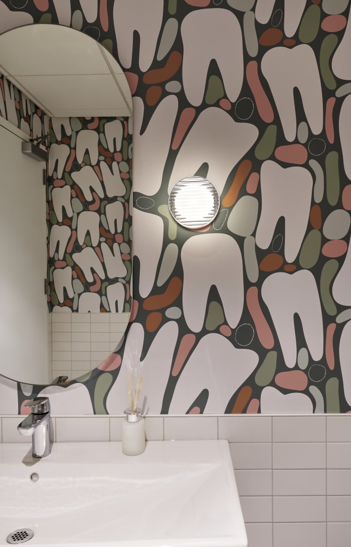Sink and mirror in teeth brushing area.
