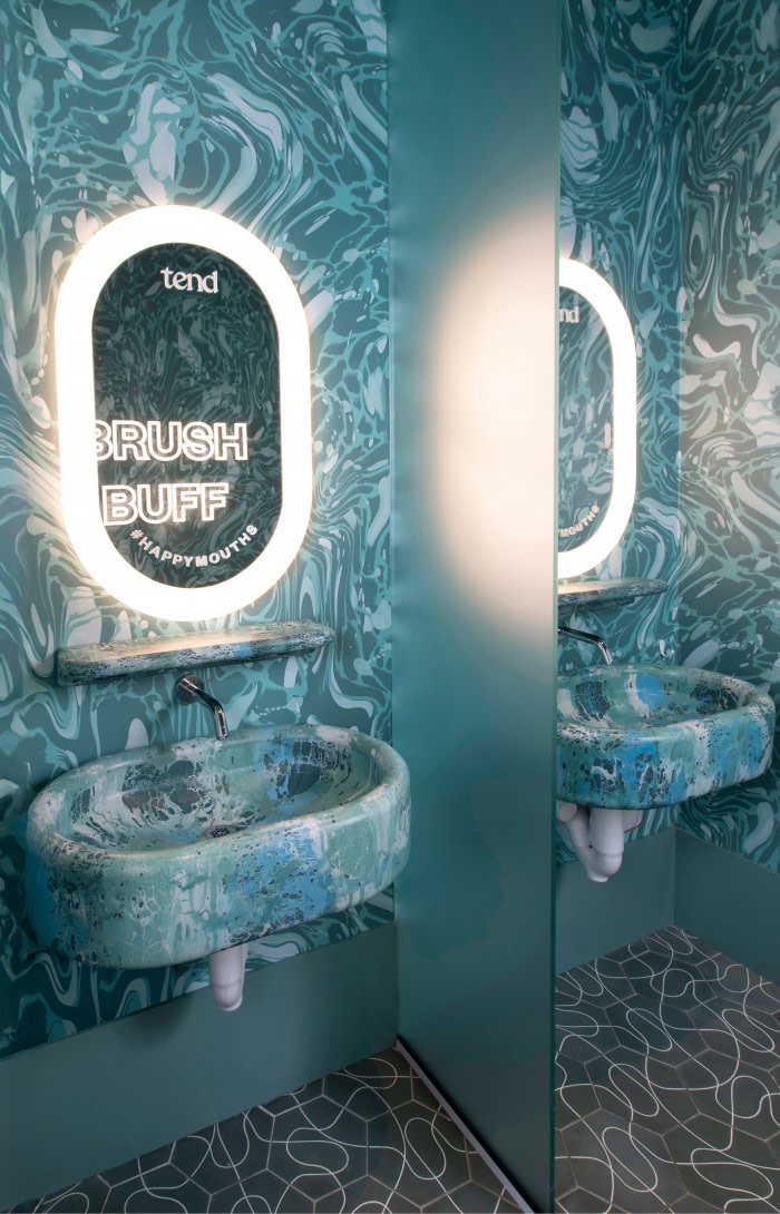 Sink and mirror in teeth brushing area.