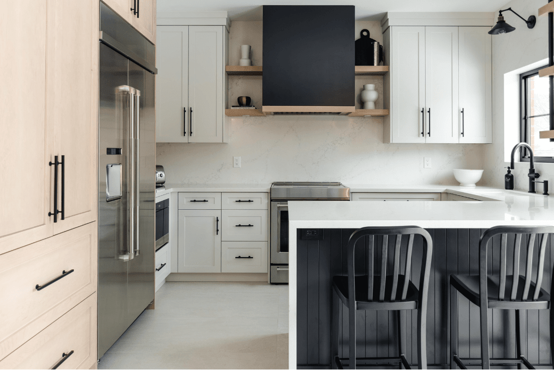 transitional-kitchen-waterfallisland-customrangehood-fridge