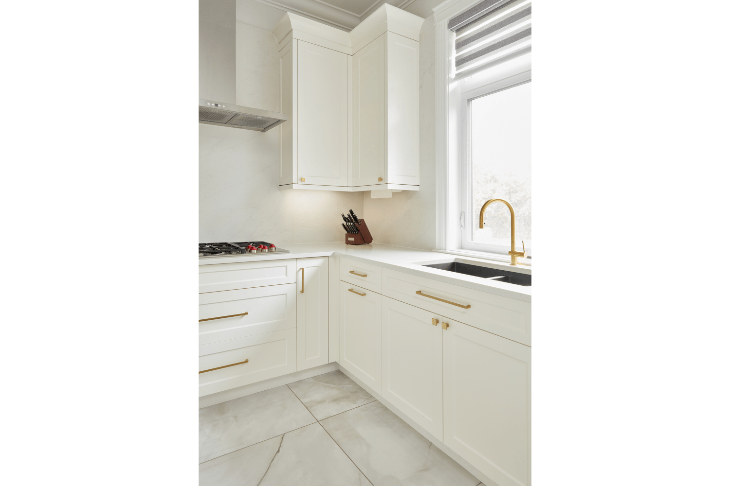 White and gold spice kitchen with sink and cooktop