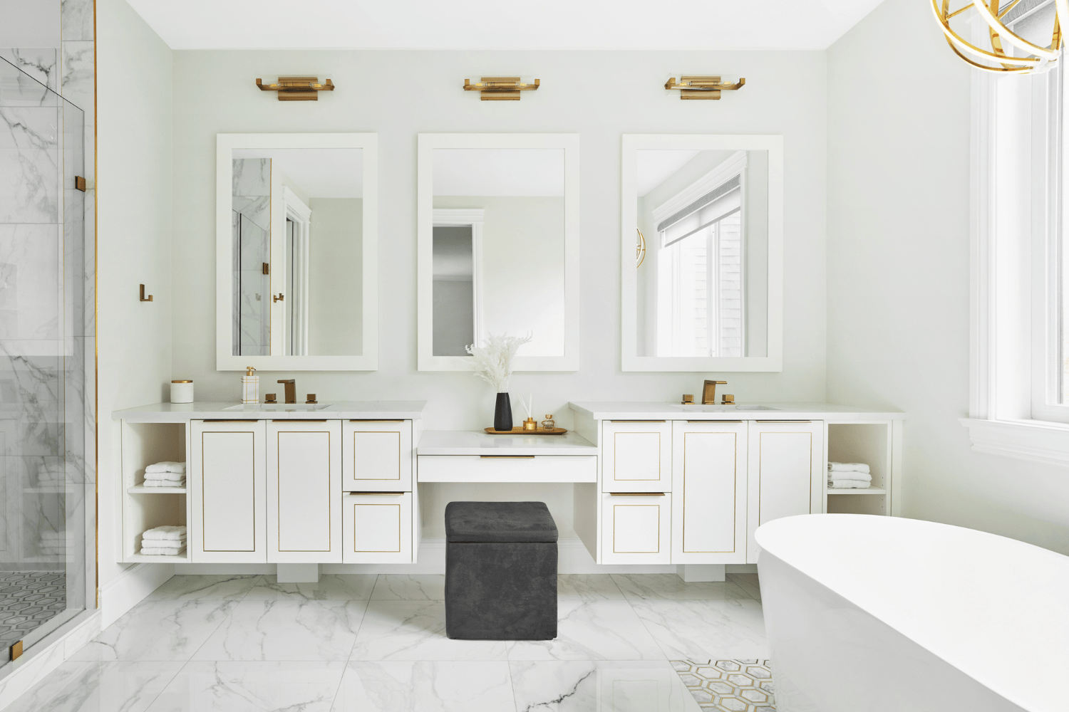 White and gold master ensuite with makeup counter
