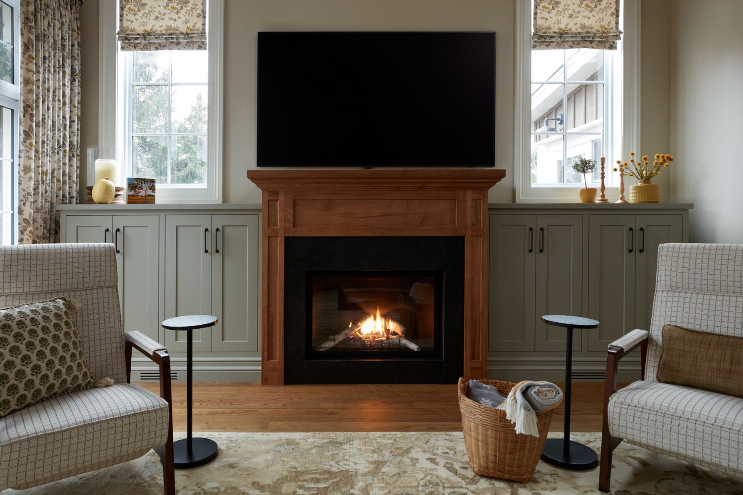 Traditional living room with maple fireplace and gray cabinets