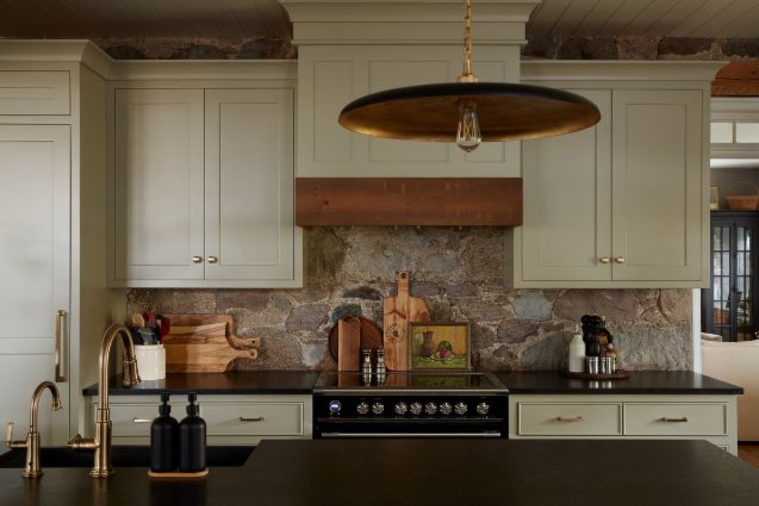 Under cabinet custom kitchen range hood with wooden detail