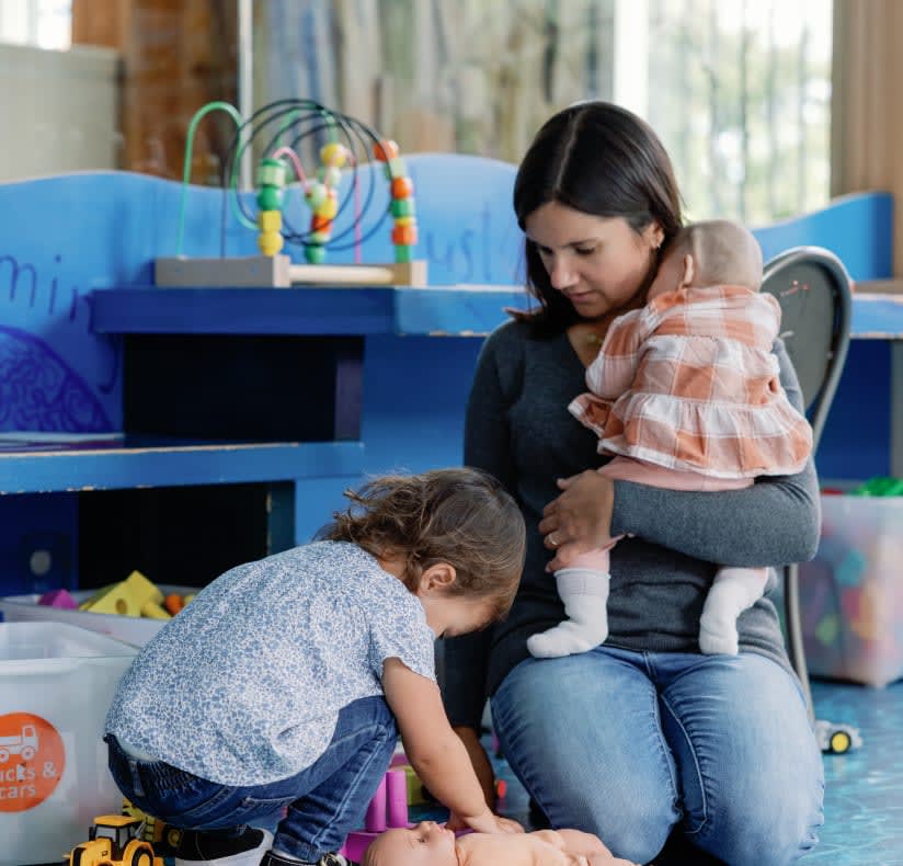 Michalski Mom and daughters in playroom