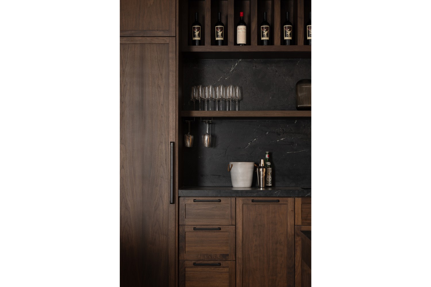 Walnut Cabinetry and Black Countertop in Rustic Rec Room