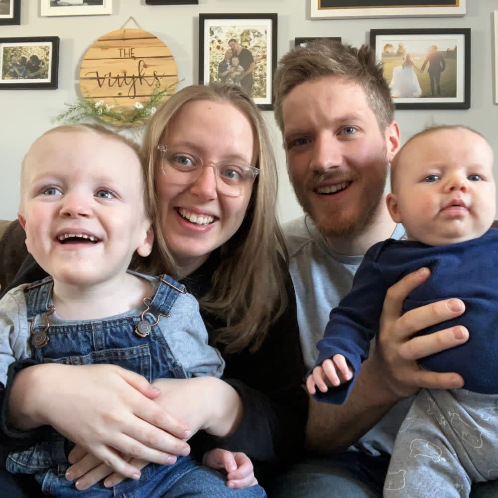 mom, dad, two toddler boys on couch