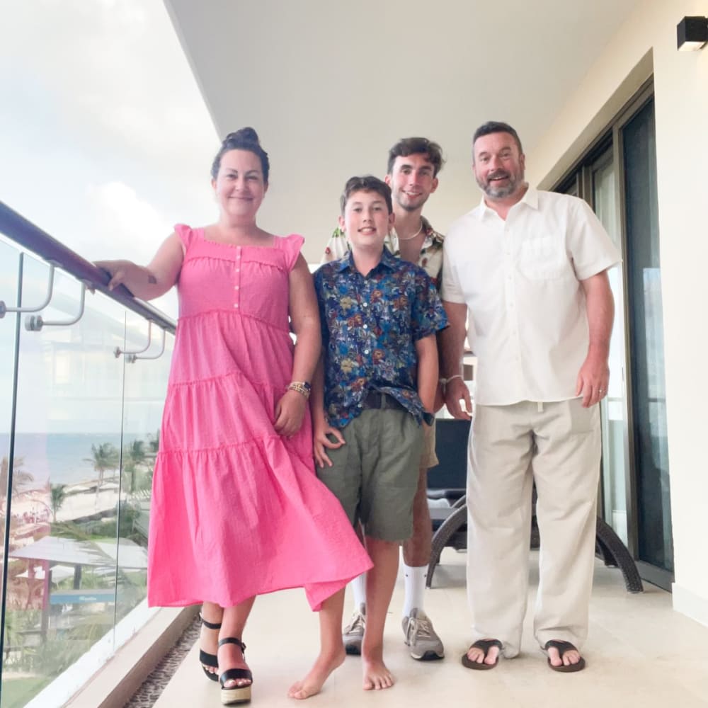 Mom, dad, two teenage boys on a patio