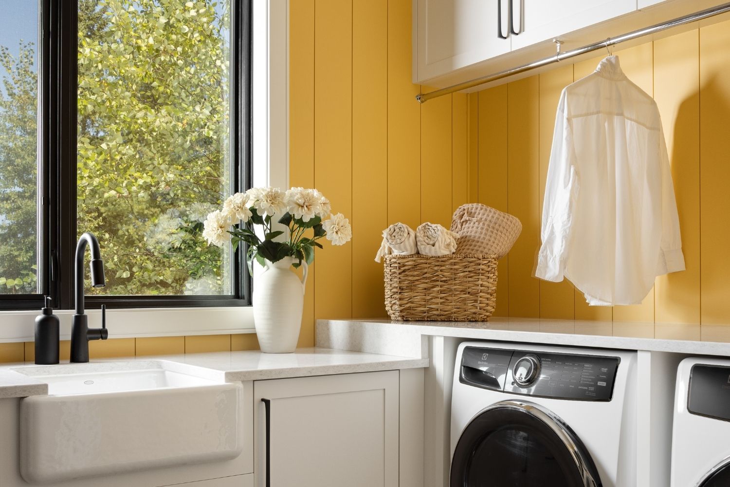 Bangor Lodge modern and bright yellow laundry room