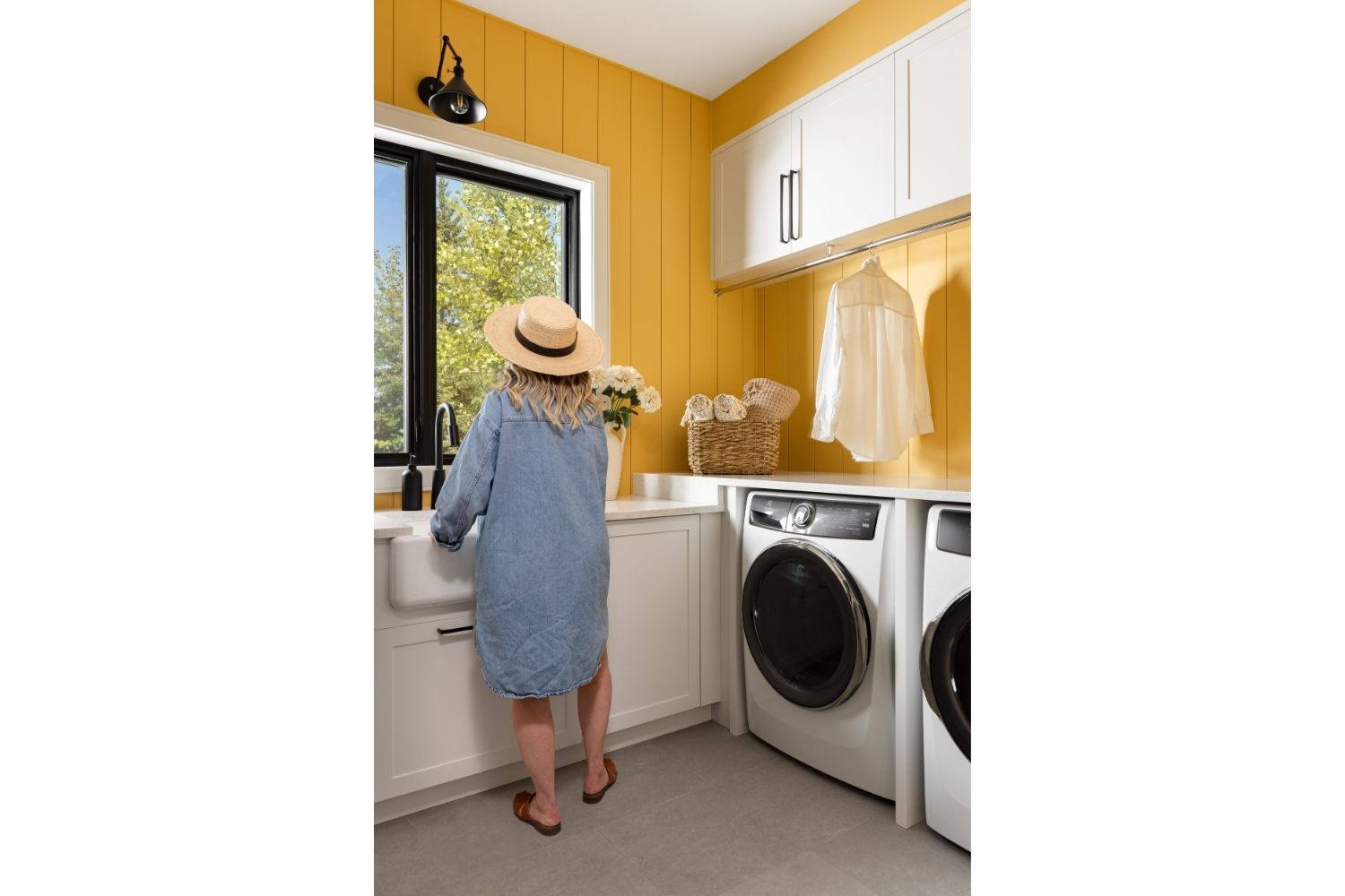 Bangor Lodge laundry room with cabinetry, sink and hanging rod