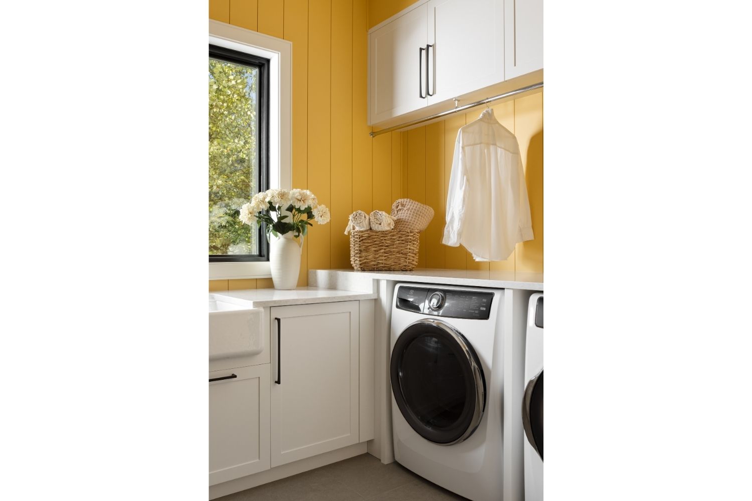 Bangor Lodge laundry room with bright white cabinetry