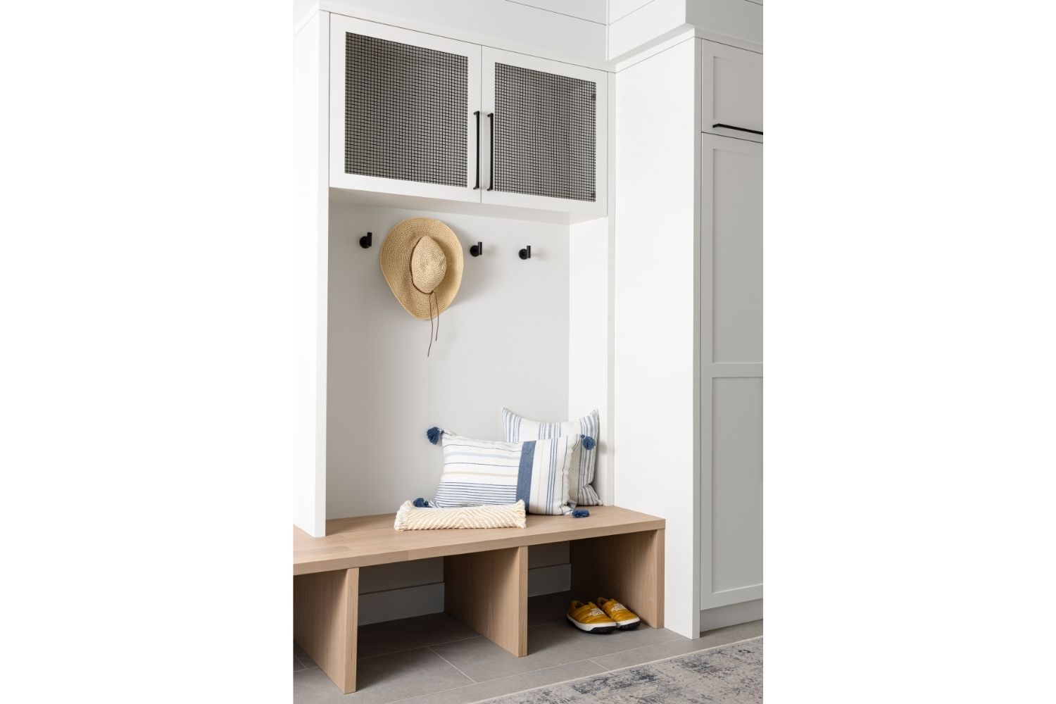 Bangor Lodge white mudroom with storage and bench