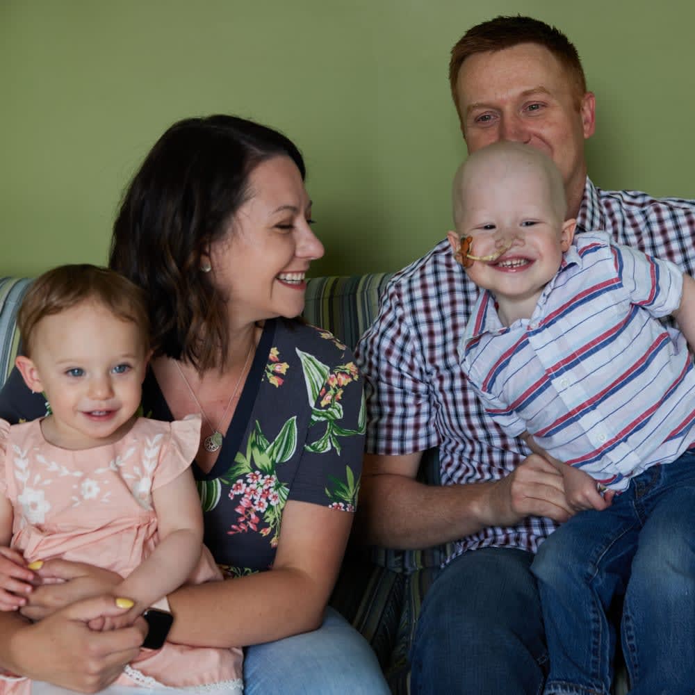 Family of four on couch