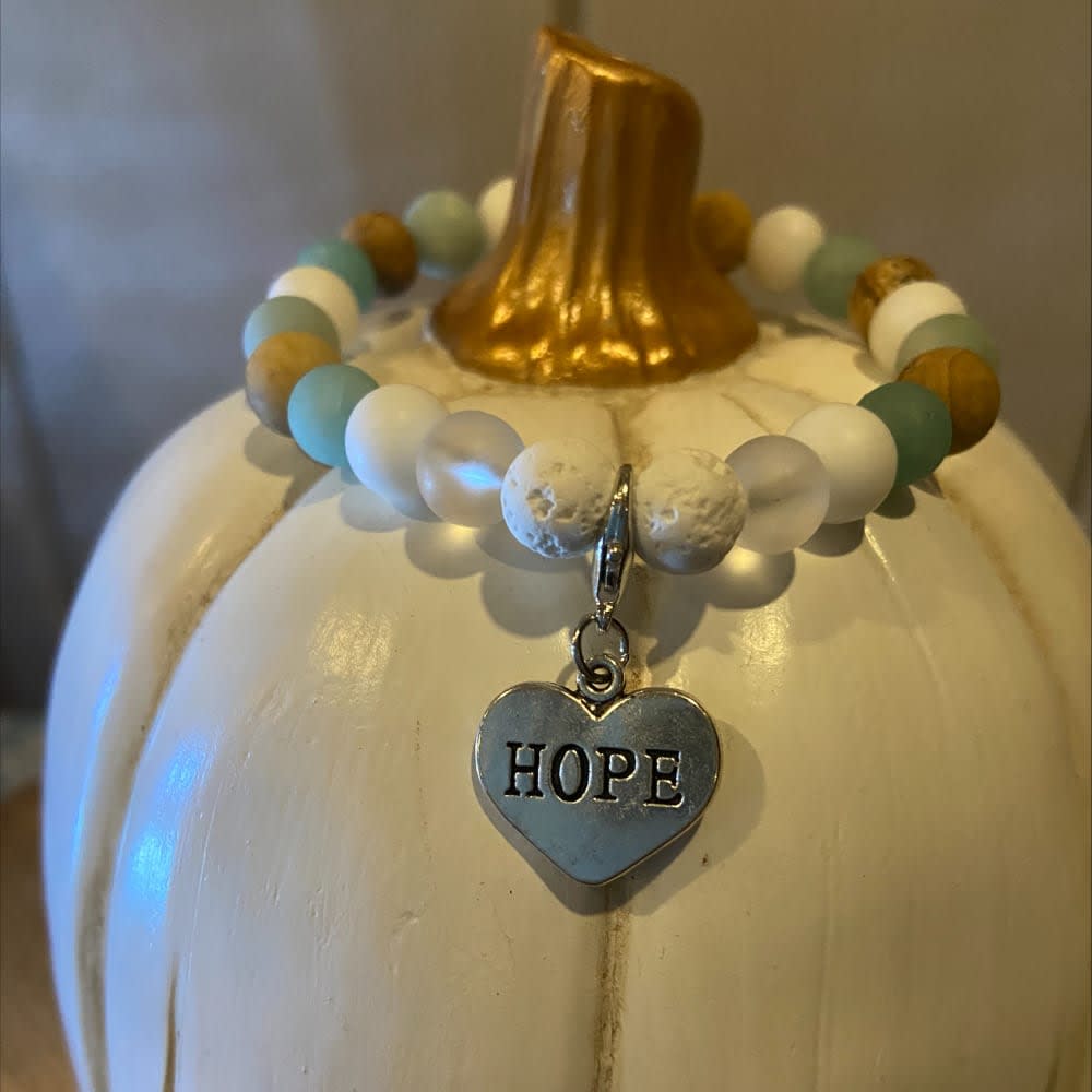 White pumkin and bracelet reading 