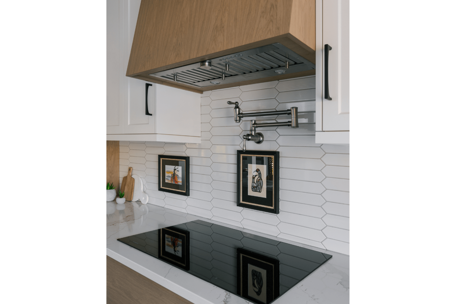 White oak range hood and pot filler faucet