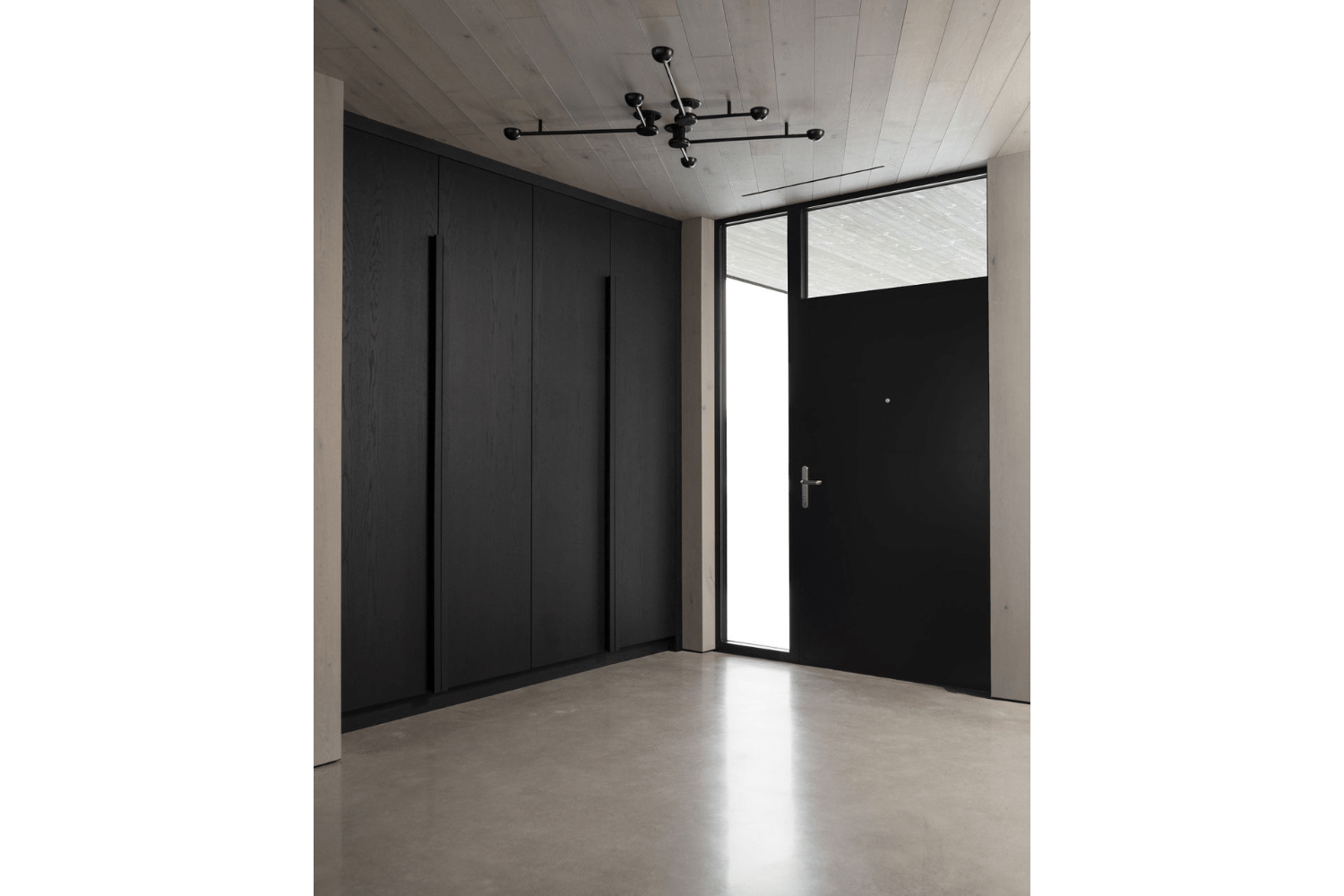 Modern industrial black front entry foyer