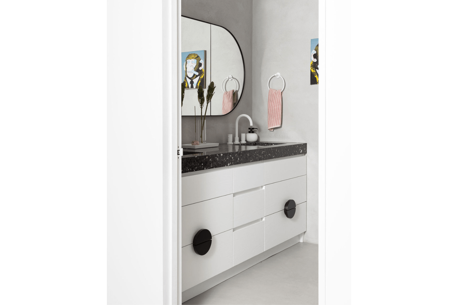 White bathroom vanity with custom pulls