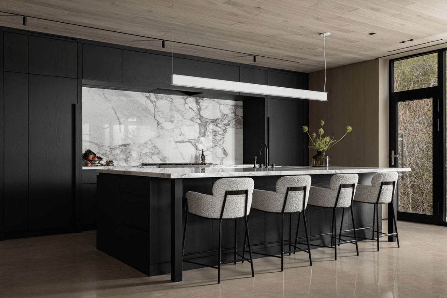 Black and white kitchen design with black cabinetry