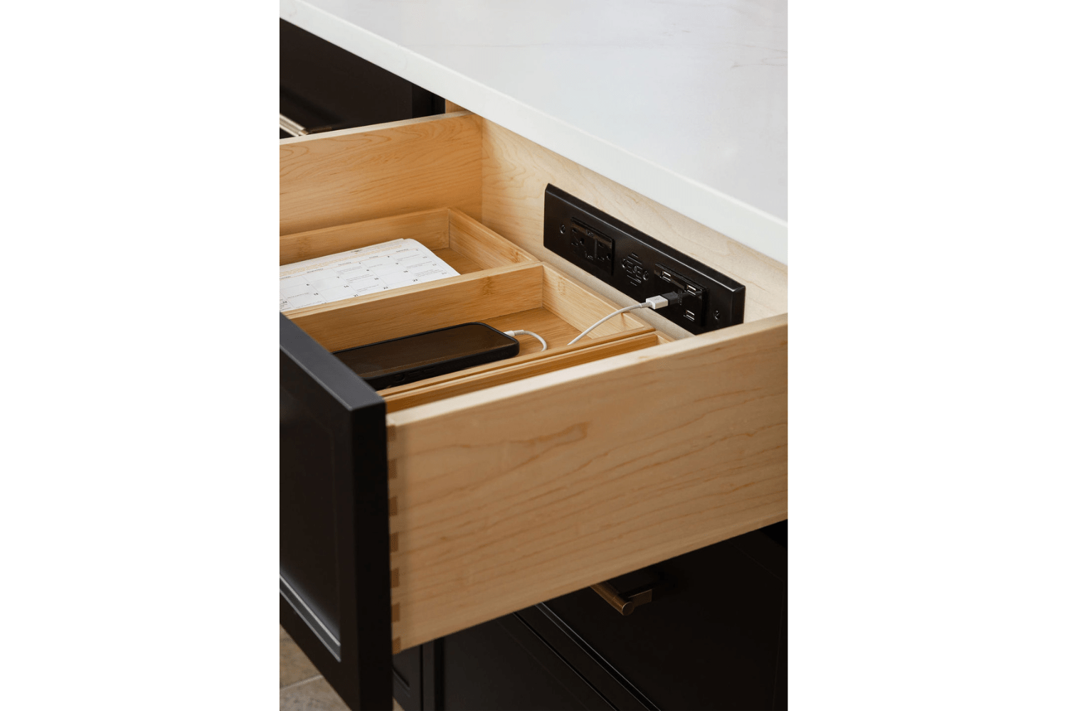 Docking drawer in kitchen for charging electronics