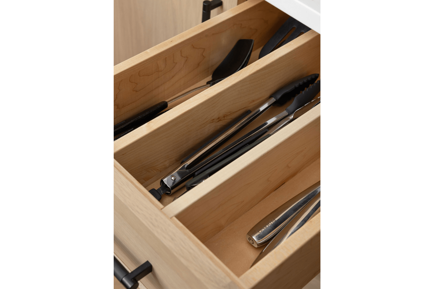 Custom utensil divider drawer in custom kitchen